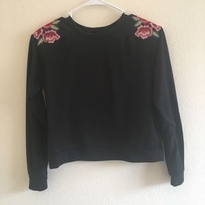 black sweater with flower embellished shoulders